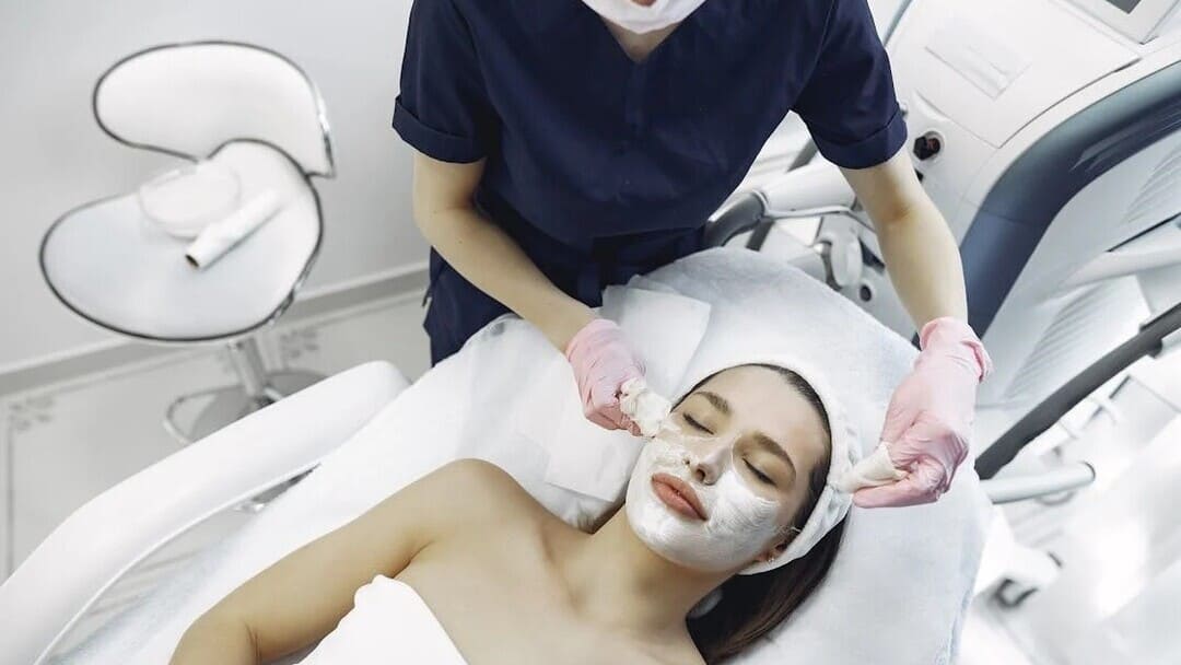 Dermatologist doing procedures on a girl